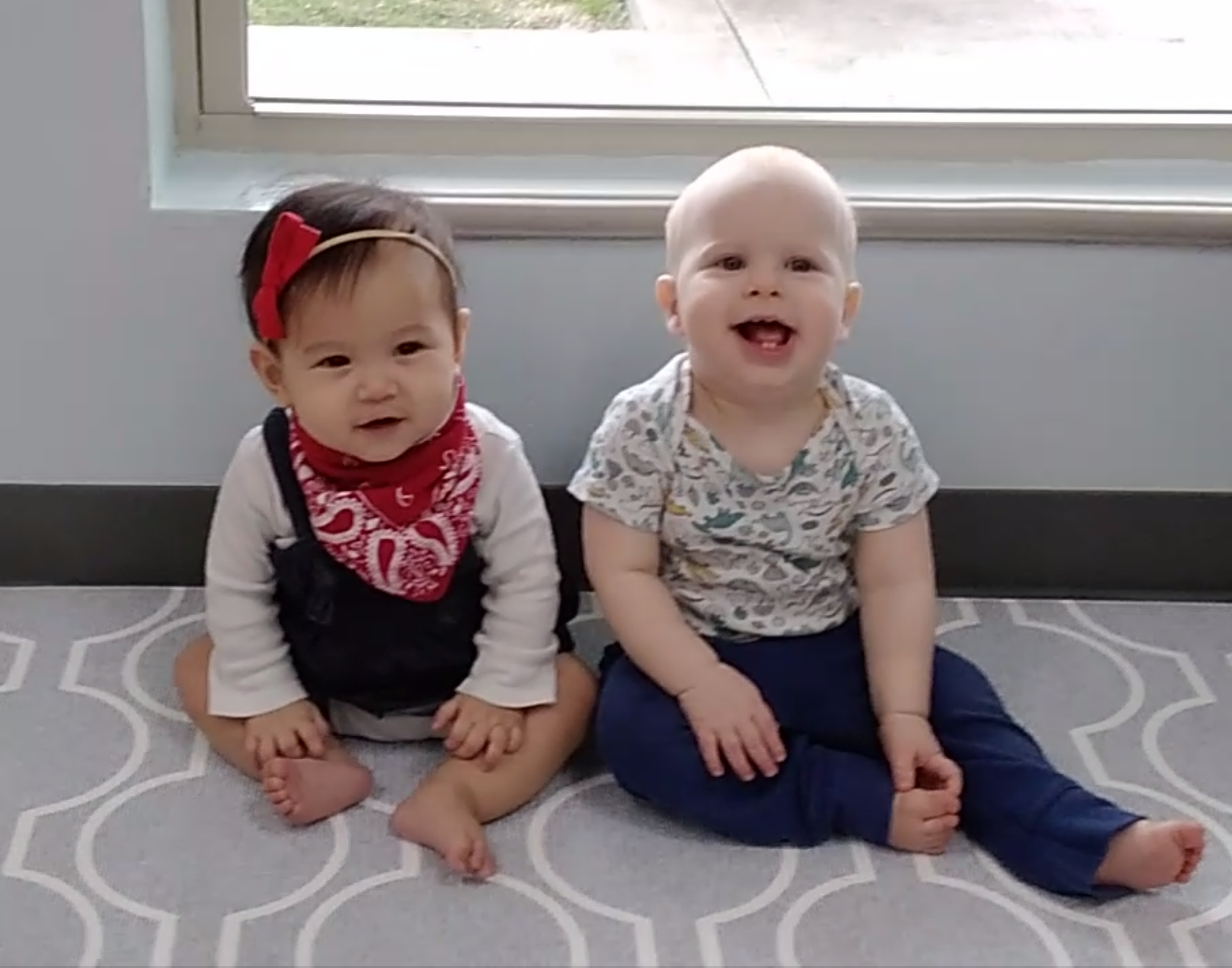Infants smiling in Nido classroom at Meadow Montessori School in Richmond, TX