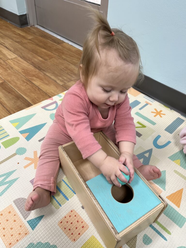 A baby learning in our Montessori Infant Daycare in Richmond, TX
