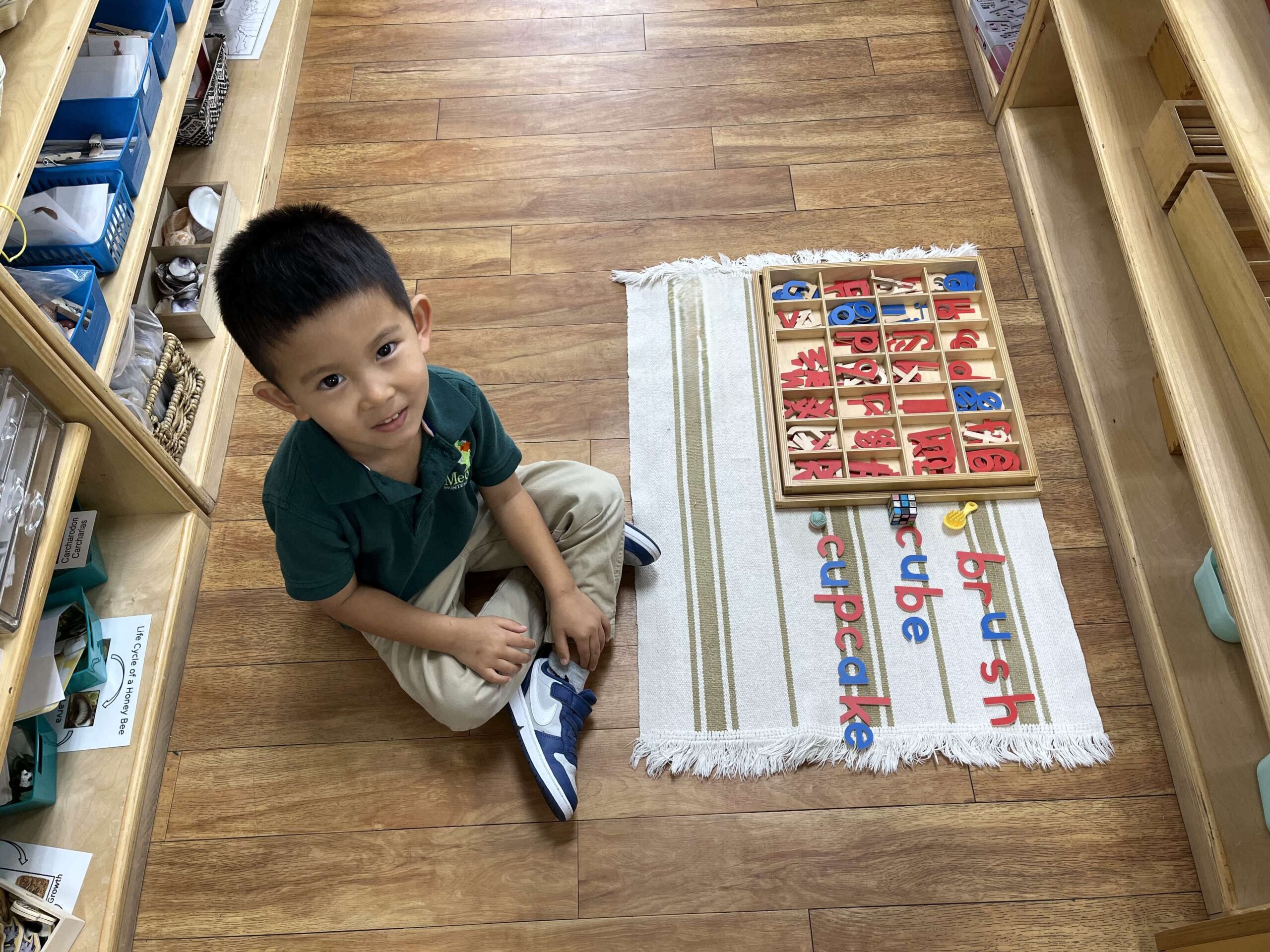 Preschool student working with Montessori materials in Early Childhood classroom at Meadow Montessori School in Richmond, TX