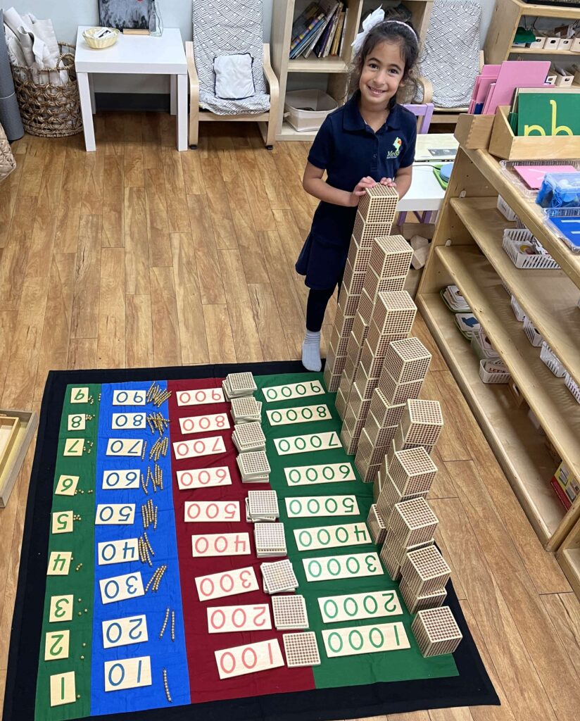 Student working with Montessori math materials as part of our Montessori preschool program in Richmond, TX